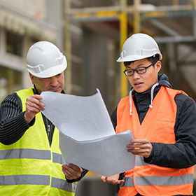 Young apprentice with senior engineer